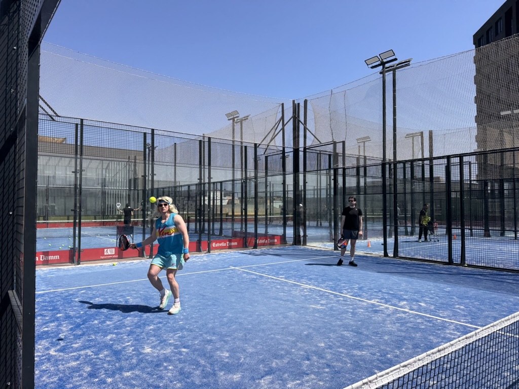 Hen party in fun costumes playing padel in Barcelona