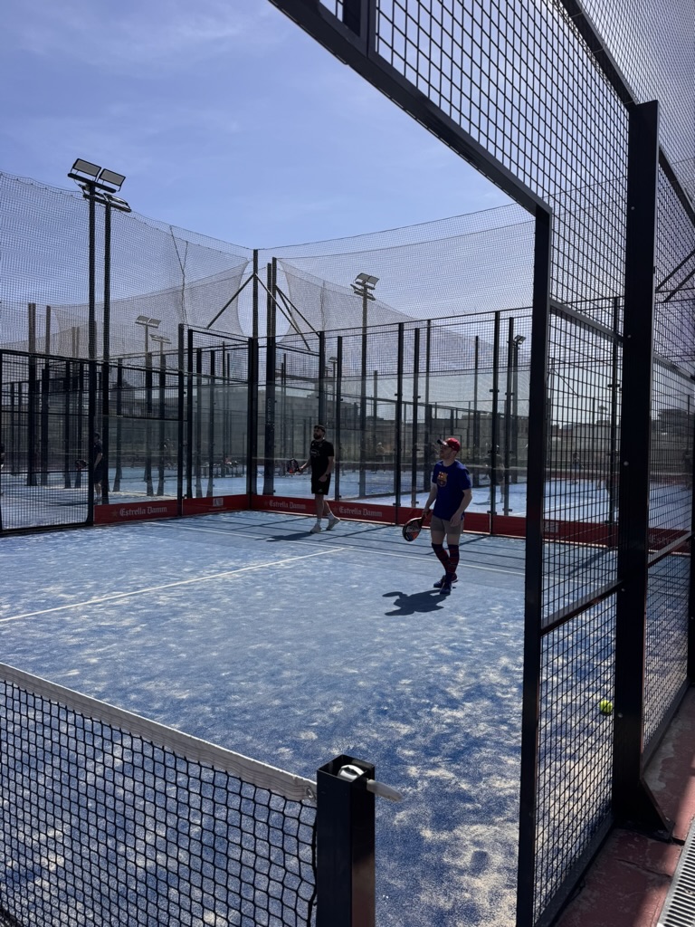 Group padel session at outdoor court in Spain