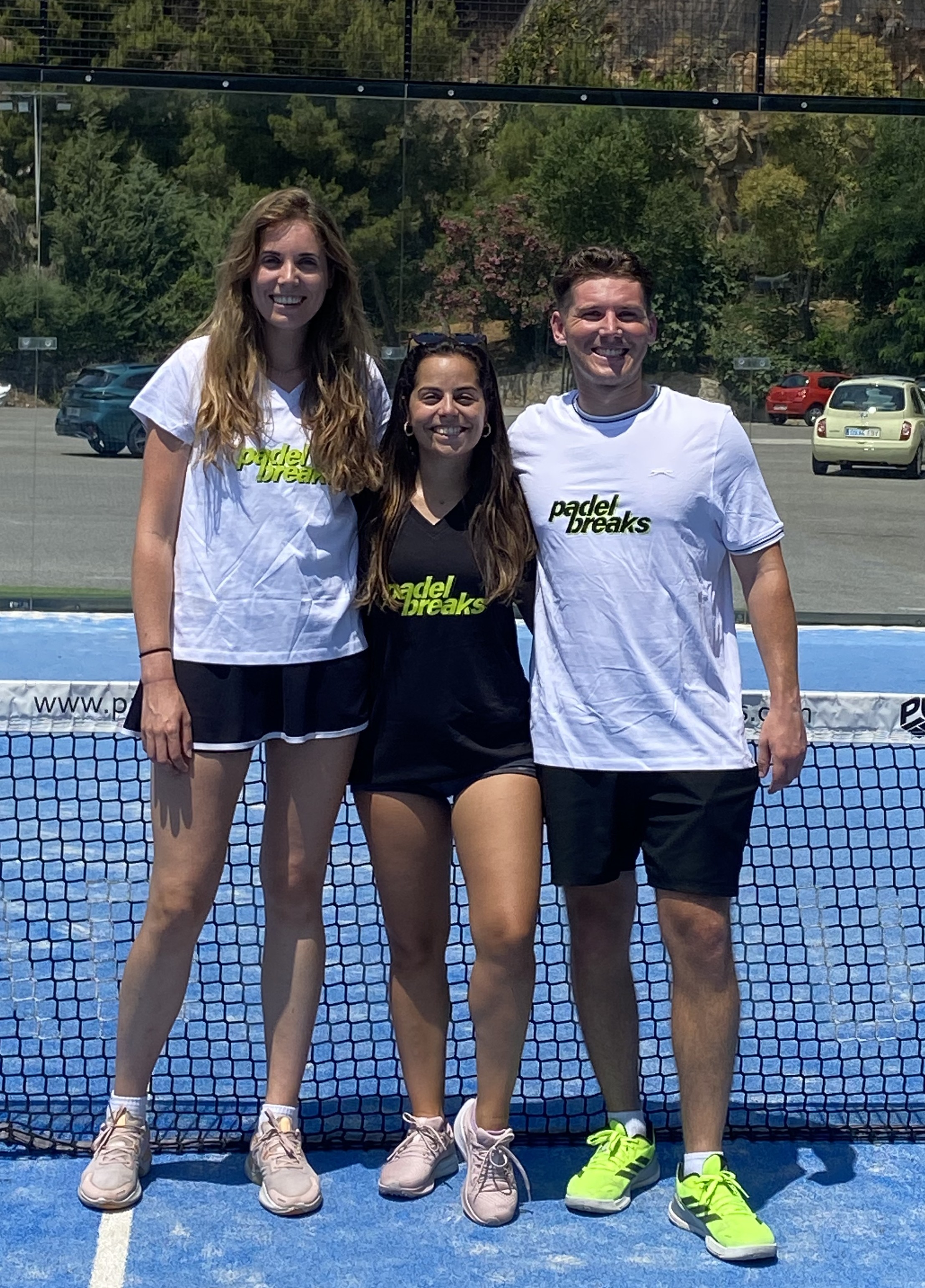 Padel Breaks founders Marta, Elena and Will on padel court - creators of padel holiday Spain experiences